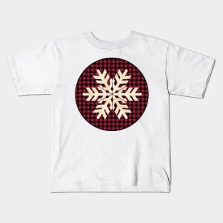Snowflake silhouette over a black and red tile pattern Kids T-Shirt